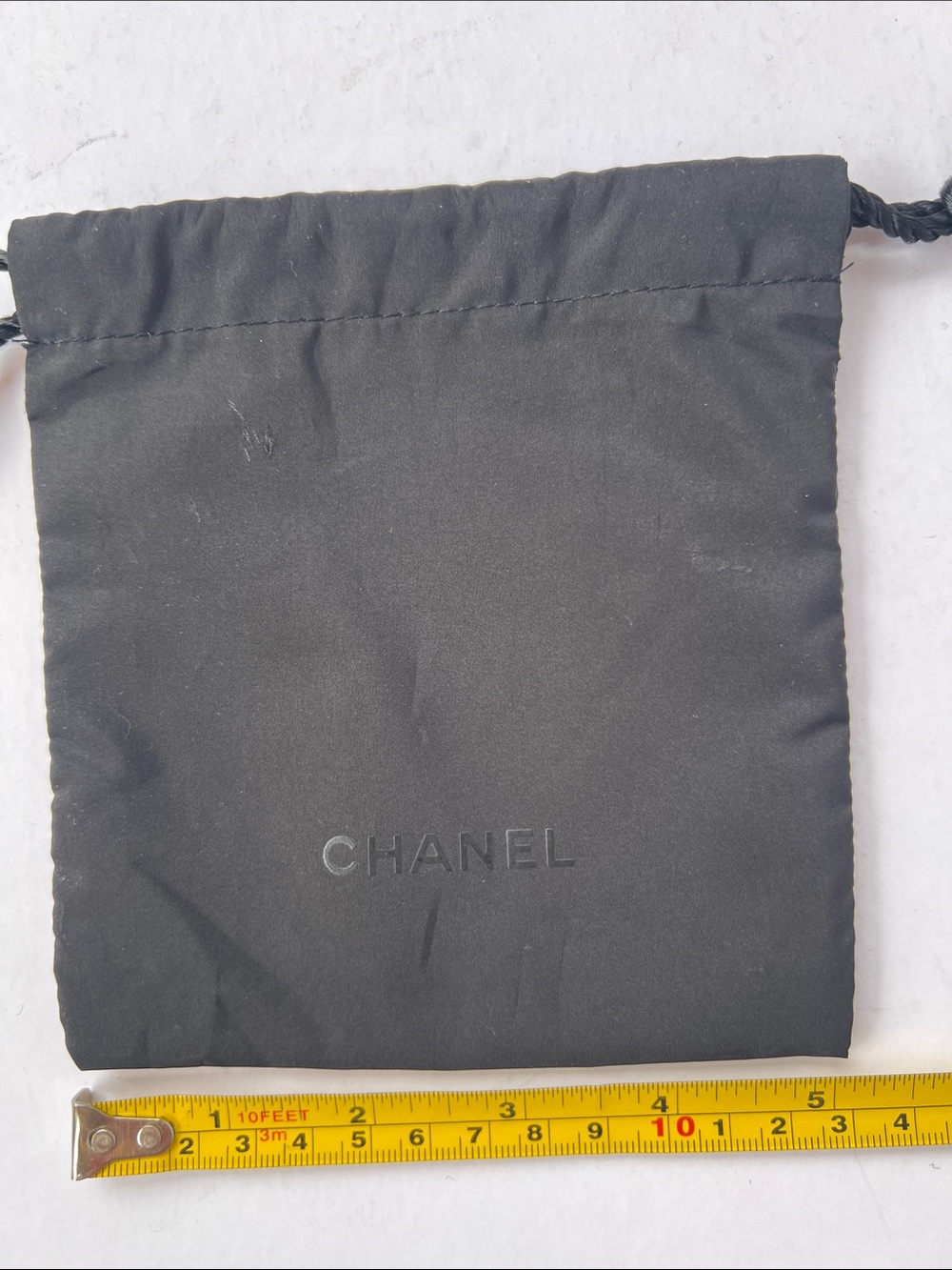CHANEL Black Drawstring Pouch with Embossed Logo